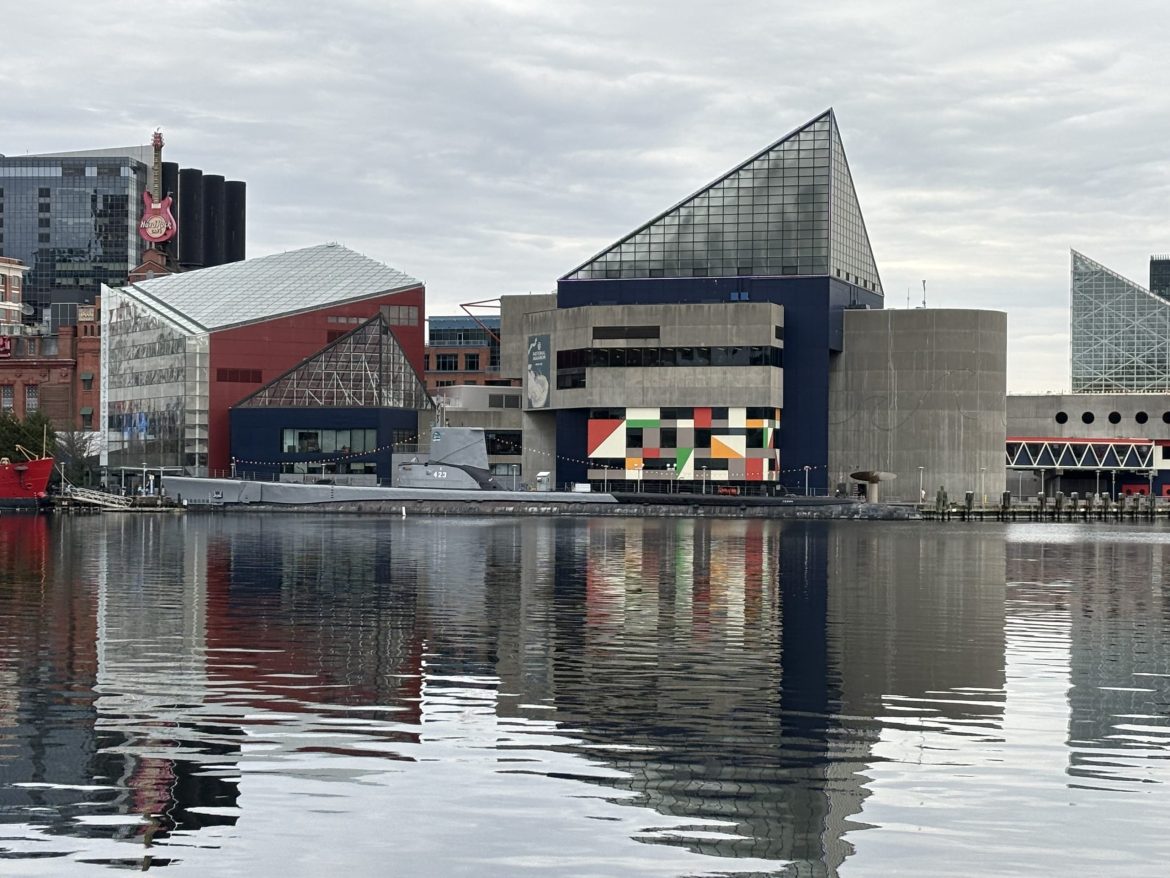 Photo of Baltimore's Inner Harbor - building on the side of a waterfront pier.